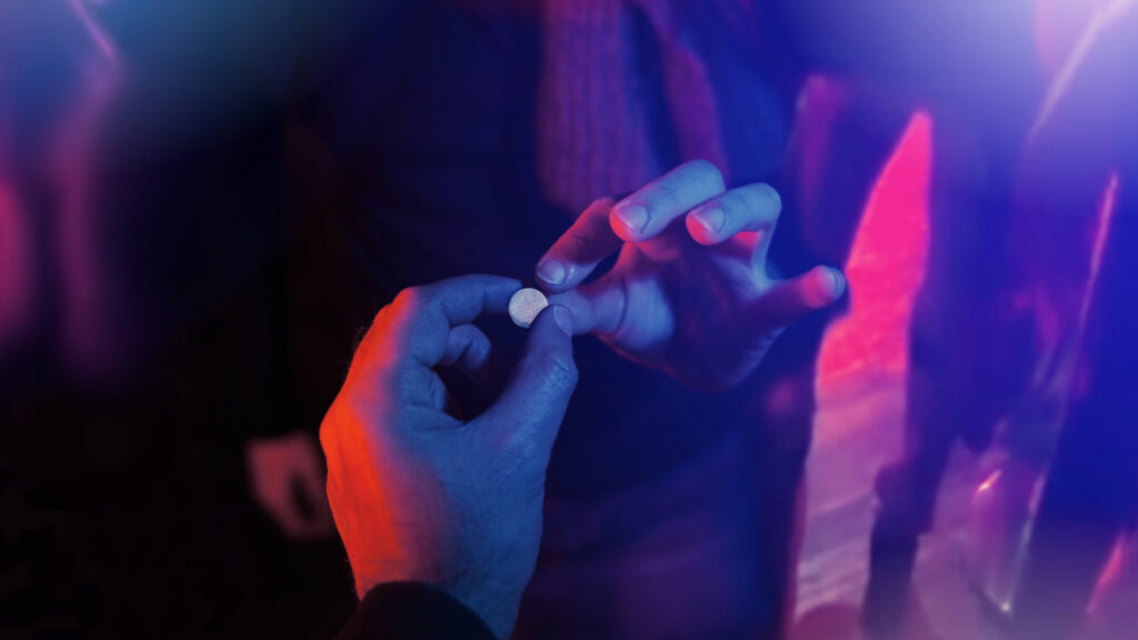 Woman buying MDMA in a club