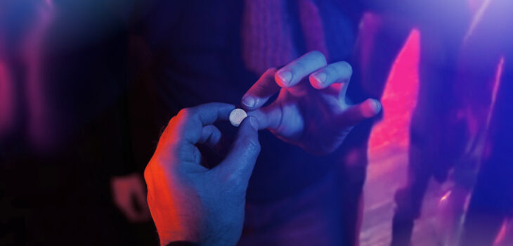 Woman buying MDMA in a club