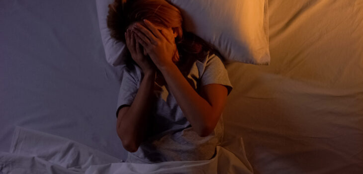Women in bed having withdrawal symptoms from an Ambien addiction